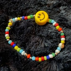 Yellow smiley face colored beads bracelet with adjustable tension